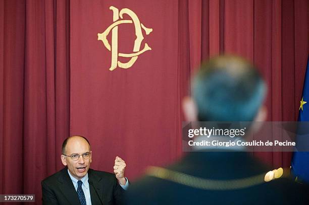 Italian Prime Minister Enrico Letta gestures as he attends the presentation of the book 'Un economista eclettico. Distribuzione, tecnologie e...