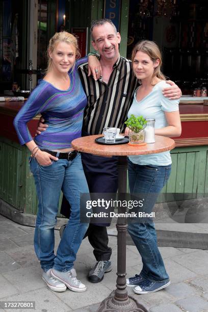 Eva-Maria Grein von Friedl, Heio von Stetten and Felicitas Woll pose during the TV production of 'Von Kerlen und Kuehen' on July 11, 2013 in Munich,...