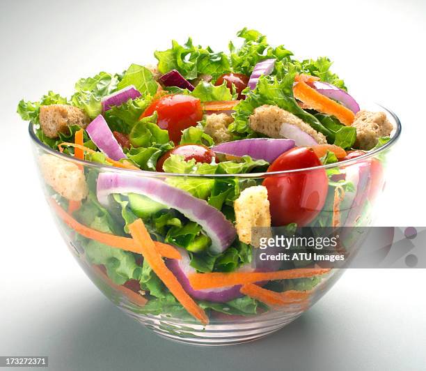 salad in glass bowl - salad bowl stock pictures, royalty-free photos & images