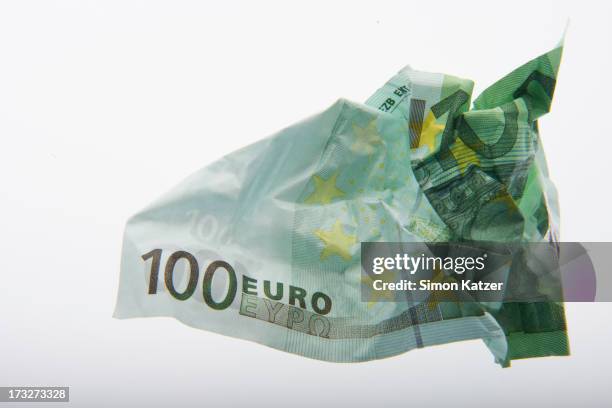 rumpled one hundred euro banknote - one hundred euro note stock pictures, royalty-free photos & images