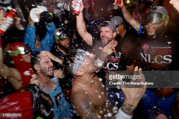 The Philadelphia Phillies celebrate in the clubhouse after beating the Atlanta Braves 3-1 in Game Four of the Division Series at Citizens Bank Park...