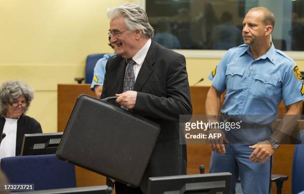 Bosnian Serb wartime leader Radovan Karadzic appears in the courtroom for his appeals judgement at the International Criminal Tribunal for Former...