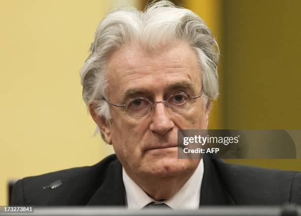 Bosnian Serb wartime leader Radovan Karadzic appears in the courtroom for his appeal judgement at the International Criminal Tribunal for Former...