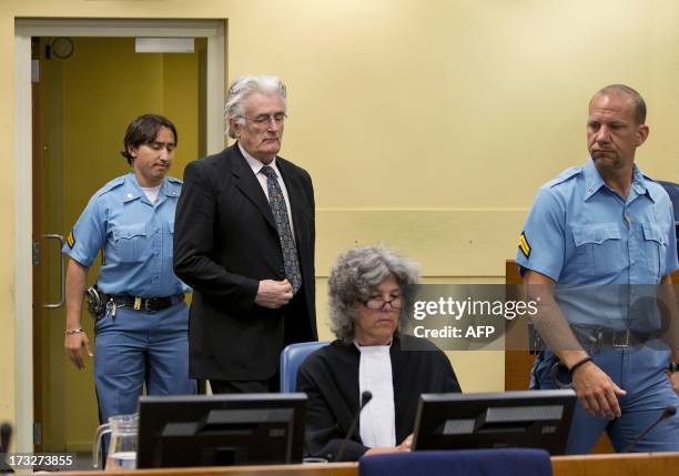 Bosnian Serb wartime leader Radovan Karadzic appears in the courtroom for his appeal judgement at the International Criminal Tribunal for Former...