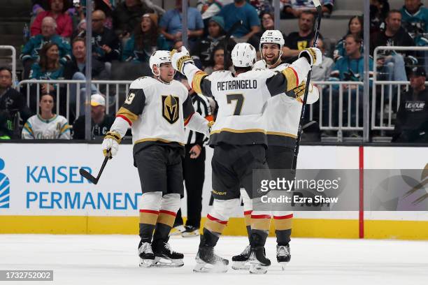 Nicolas Hague of the Vegas Golden Knights is congratulated by Alex Pietrangelo after he scored against the San Jose Sharks in the second period at...