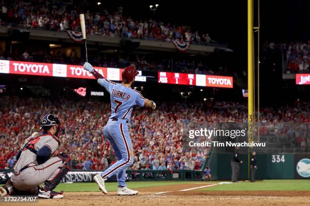 Trea Turner of the Philadelphia Phillies hits a home run in the fifth inning against the Atlanta Braves during Game Four of the Division Series at...