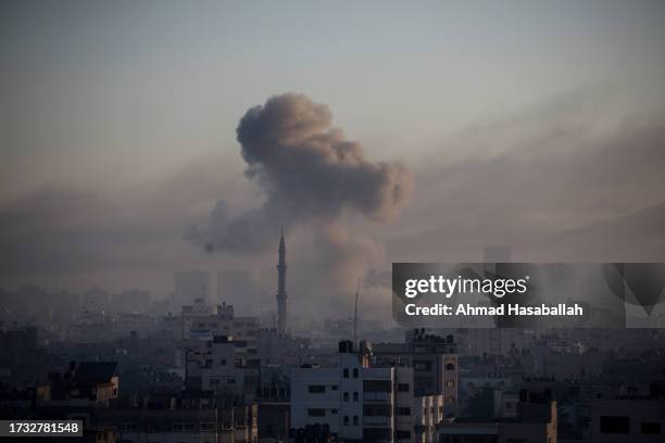 Smoke rises from Israeli air raids on October 13, 2023 in Gaza City, Gaza. At least 1,200 people, including at least 326 children, have been killed...