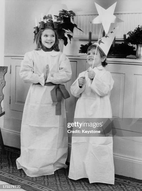 Crown Princess Victoria of Sweden and her brother, Prince Carl Philip of Sweden, pose in costumes for the camera, 1984.