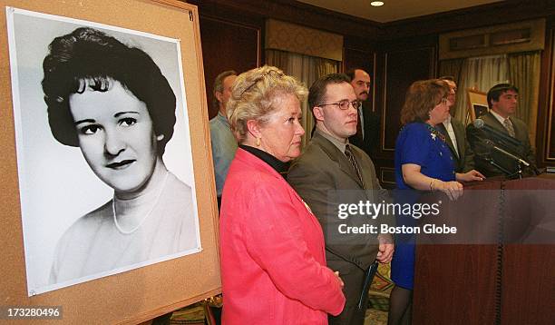 Diane Dodd, center, with her son Casey Sherman, at a press conference asking officials to release information and evidence concerning the murder of...