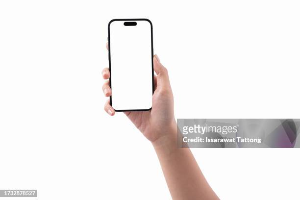 woman hand holding smartphone isolated on white background - smartphone mockup stock-fotos und bilder