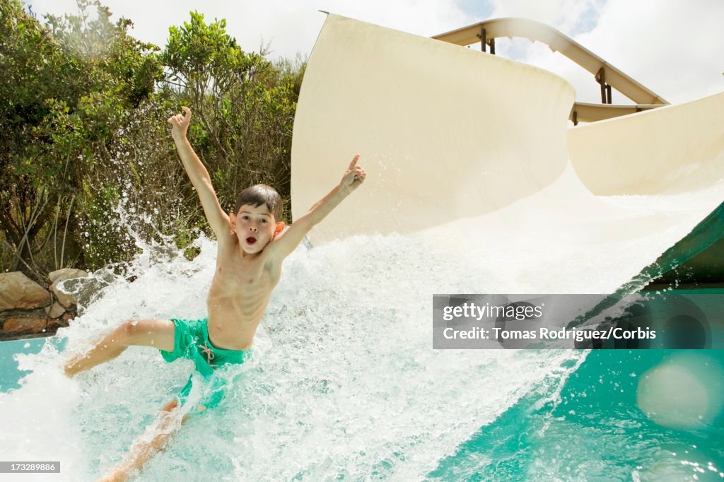 Slide Falling Boy Falling From Water Slide Into Swimming Pool High-Res Stock Photo ...