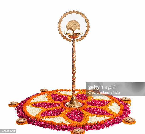 oil lamps and rangoli of flowers at onam - rangoli stock pictures, royalty-free photos & images