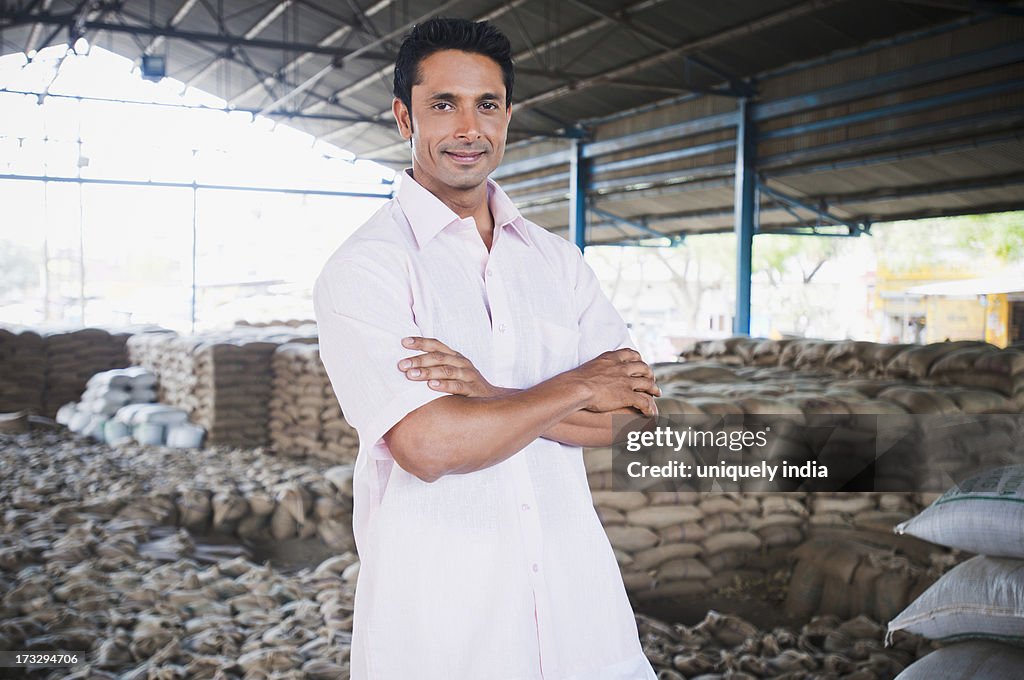 Man standing in a warehouse, Anaj Mandi, Sohna, Gurgaon, Haryana, India