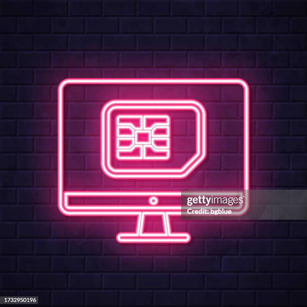 desktop computer with sim card. glowing neon icon on brick wall background - computer screen close up stock illustrations