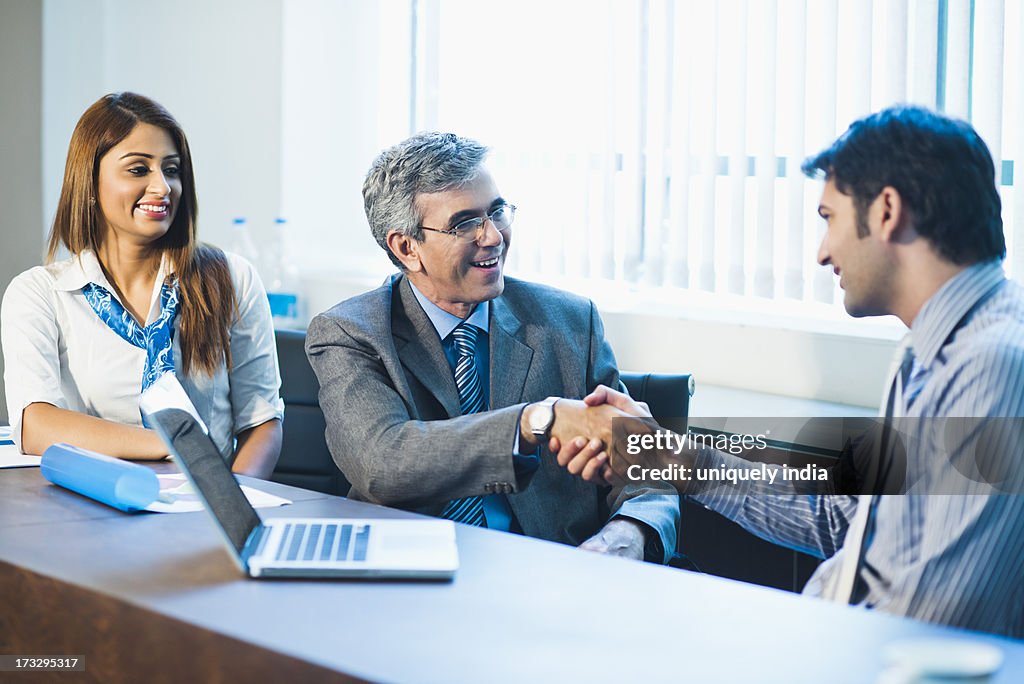 Businessman shaking hand with another businessman