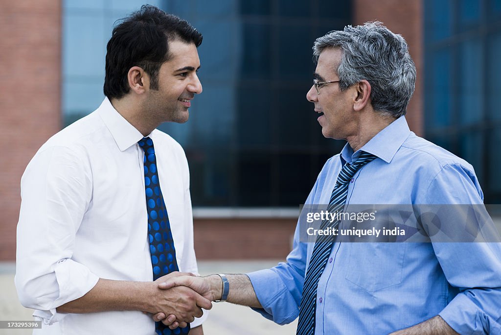 Businessman shaking hands with another businessman