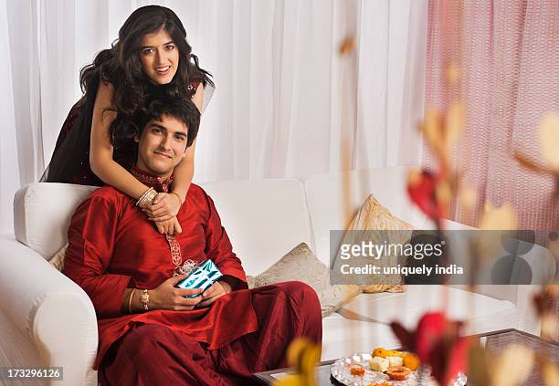 man with his sister at raksha bandhan - rakhi ストックフォトと画像