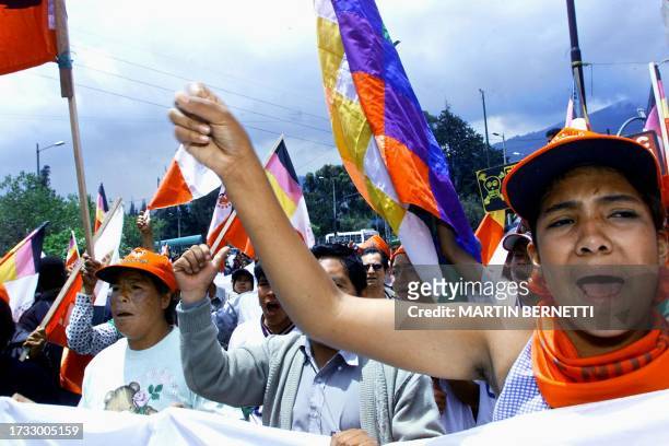 Activists for social and indigenous organizations protest in front of a McDonald's fast food outlet 30 October, 2002 in Quito during a protest...