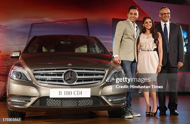 Mercedes-Benz India MD & CEO Eberhard Kerm with Bollywood actors Aditi Rao and Abhay Deol posing with the newly launched Mercedes-Benz New B-Class...