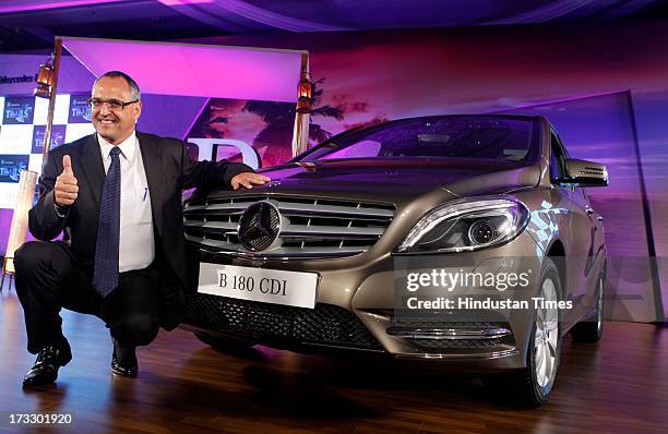 Mercedes-Benz India MD & CEO Eberhard Kerm posing with the newly launched Mercedes-Benz New B-Class 180 CDI luxury Tourer on July 11, 2013 in Mumbai,...
