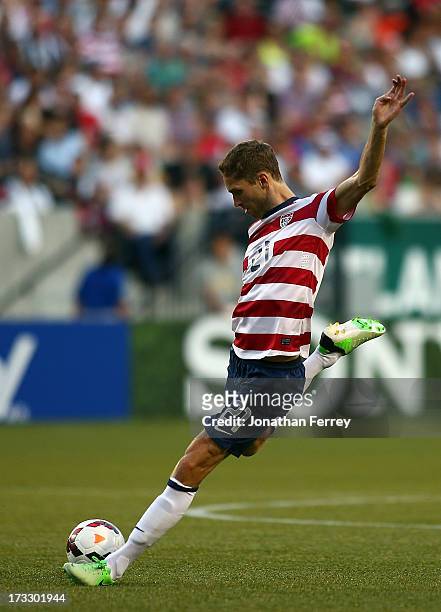 Clarence Goodson of the United States kicks the ball against Belize during the 2013 CONCACAF Gold Cup on July 9, 2013 at Jeld-Wen Field in Portland,...