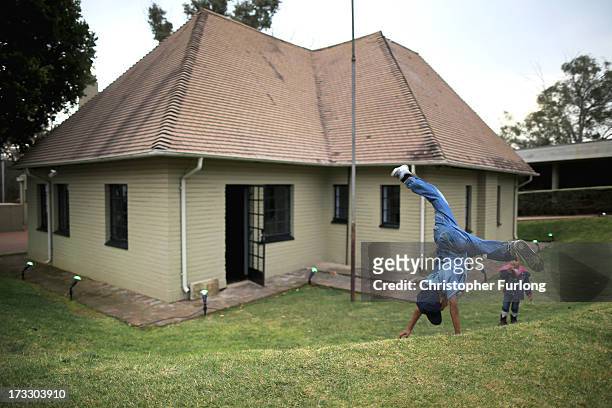 Children play during anniversary celebrations at Liliesleaf Farm the apartheid-era hideout for Nelson Mandela and freedom fighters in Johannesburg on...