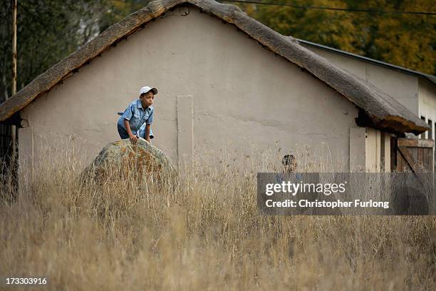 Children play during anniversary celebrations at Liliesleaf Farm; the apartheid-era hideout for Nelson Mandela and freedom fighters in Johannesburg...