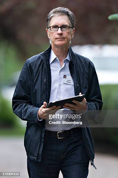 John Henry, owner of the Boston Red Sox Baseball Club LP, arrives for a morning session during the Allen & Co. Media and Technology Conference in Sun...