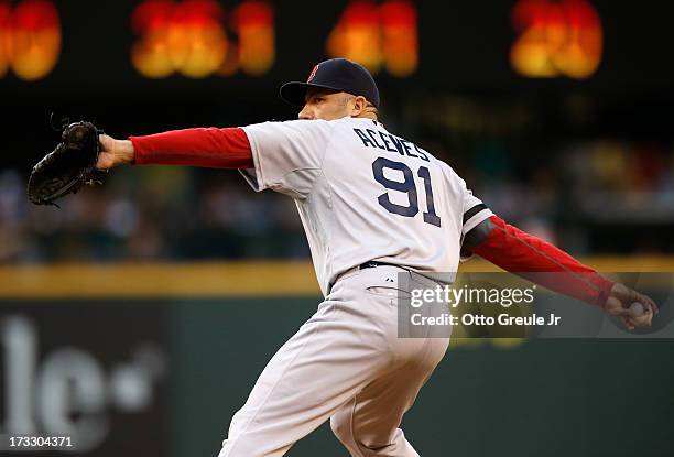 Relief pitcher Alfredo Aceves of the Boston Red Sox pitches against the Seattle Mariners at Safeco Field on July 9, 2013 in Seattle, Washington.