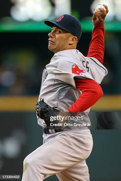 Relief pitcher Alfredo Aceves of the Boston Red Sox pitches against the Seattle Mariners at Safeco Field on July 9, 2013 in Seattle, Washington.