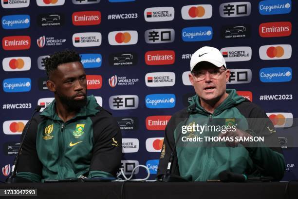 South Africa's head coach Jacques Nienaber and South Africa's flanker Siya Kolisi hold a press conference in Presles, north of Paris, on October 19...