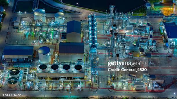 aerial view gas turbine electrical power plant in industrial estate at night time. - gas turbine electrical power plant stock pictures, royalty-free photos & images