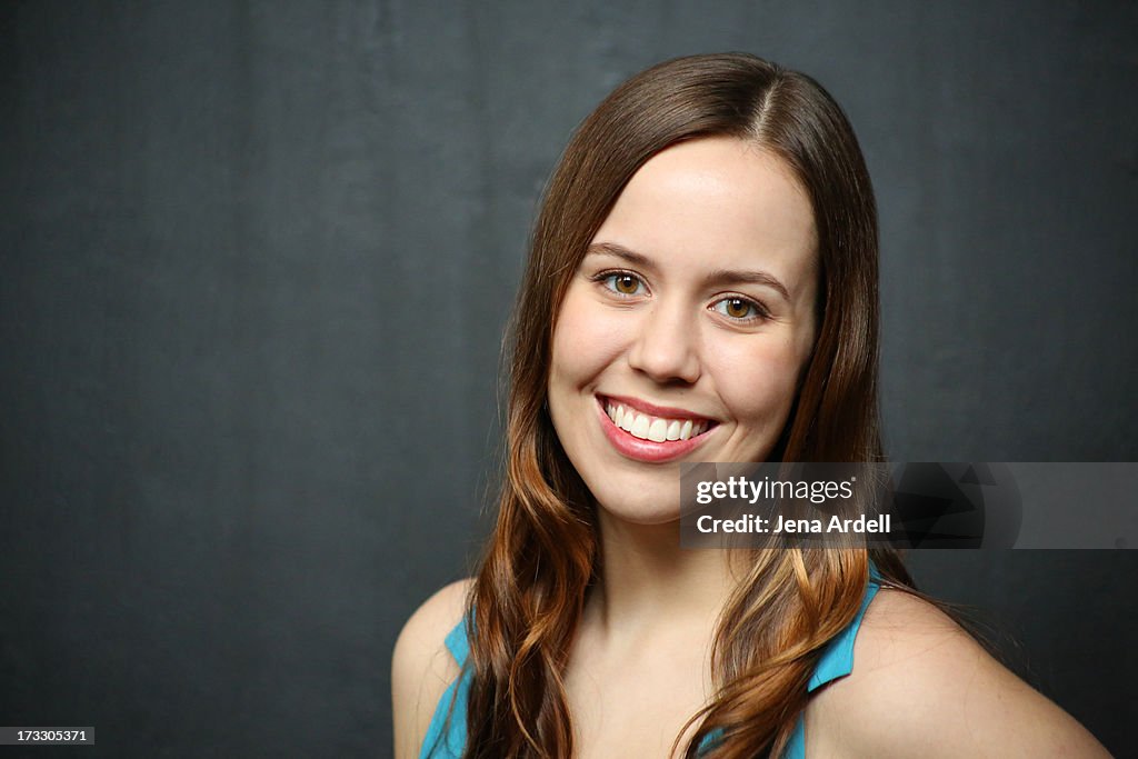 Young woman with straight teeth smiling big