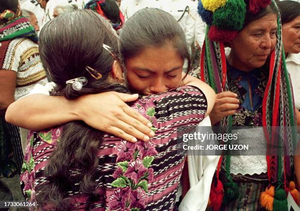 Mayan Indians mourn outside the Metropolitan Cathedral during the funeral of Bishop Juan Gerardi 29 April in Guatemala City. Thousand of mourners...