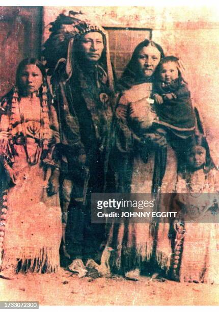 An old photograph showing Chief Long Wolf and his family, taken over 100 years ago, was held by members of the Chief's family, 25 September, as the...
