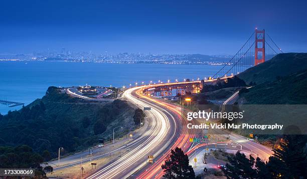 san francisco in the background - golden gate bridge night stock pictures, royalty-free photos & images