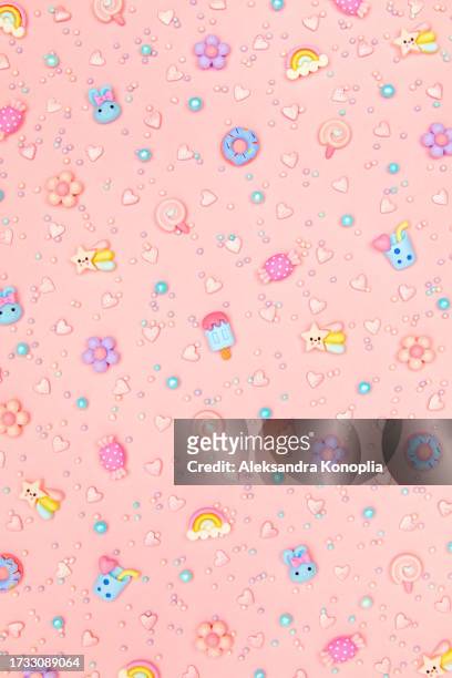 trendy pastel pink kawaii background with cute cartoon characters, rainbows , sweets - ice cream, donuts, cupcakes, candies pattern. top view, flat lay. candycore, toycore. - kawaii food stock pictures, royalty-free photos & images