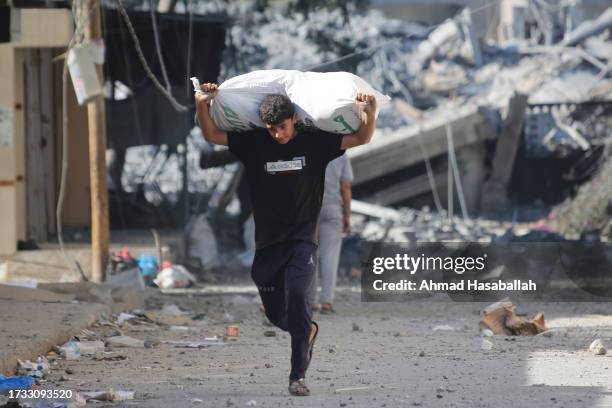 Palestinians displaced from their homes as a result of Israeli air raids on October 13, 2023 in Gaza City, Gaza. Israel has sealed off Gaza and...