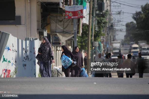 Palestinians displaced from their homes as a result of Israeli air raids on October 13, 2023 in Gaza City, Gaza. Israel has sealed off Gaza and...