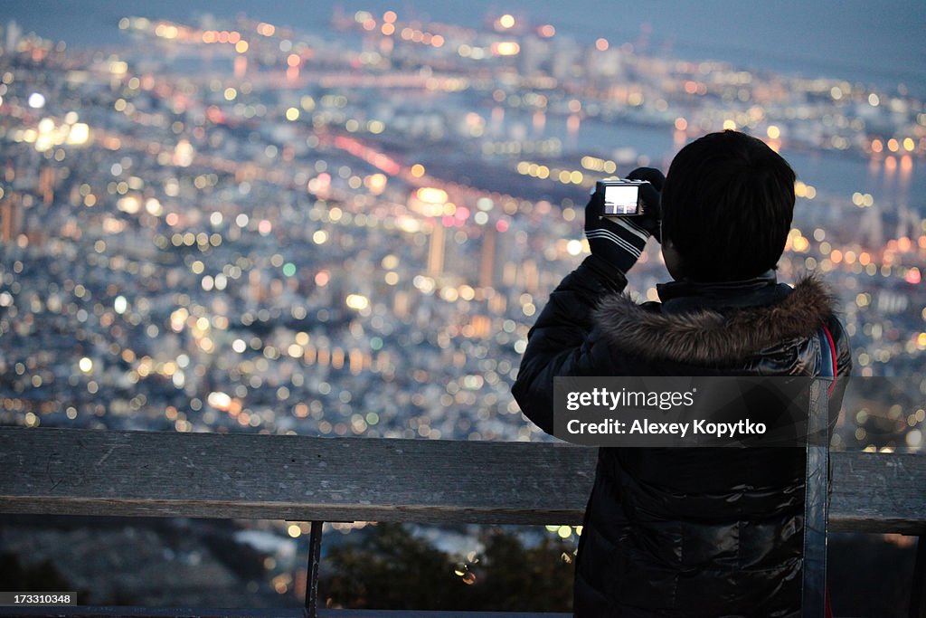 Boy enjoys night view of Kobe