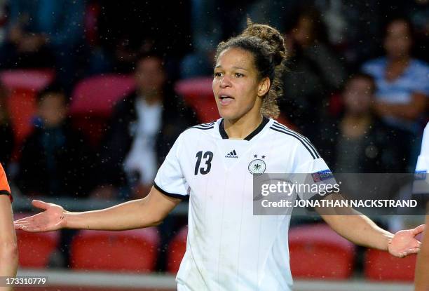 Germany's forward Celia Okoyino da Mbabi reacts during the UEFA Women's European Championship Euro 2013 group B football match Germany vs Netherlands...