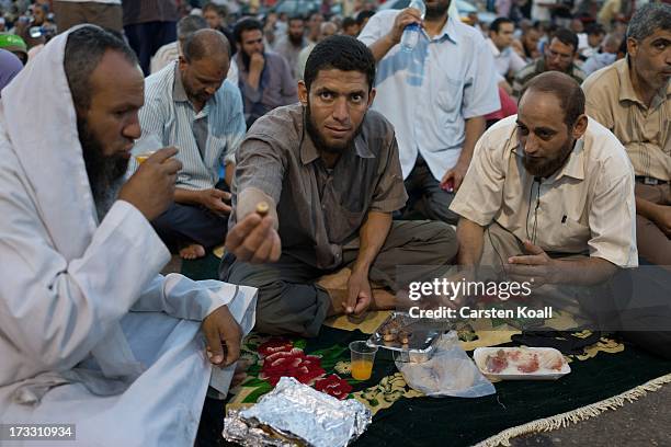 Supporters of ousted president Mohamed Morsi break their daily Ramadan fast on the second day of Ramadan, the sacred holy month for Muslims where...