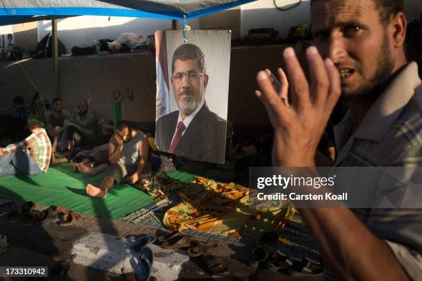 Supporter of ousted president Mohamed Morsi prays before breaking the daily Ramadan fast on the second day of Ramadan, the sacred holy month for...