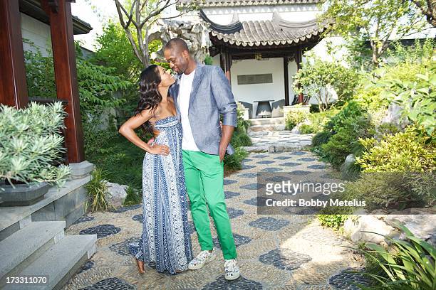 Gabrielle Union and Dwyane Wade take some photos and share a kiss on at Green City Villa on July 11, 2013 in Hangzhou, China.