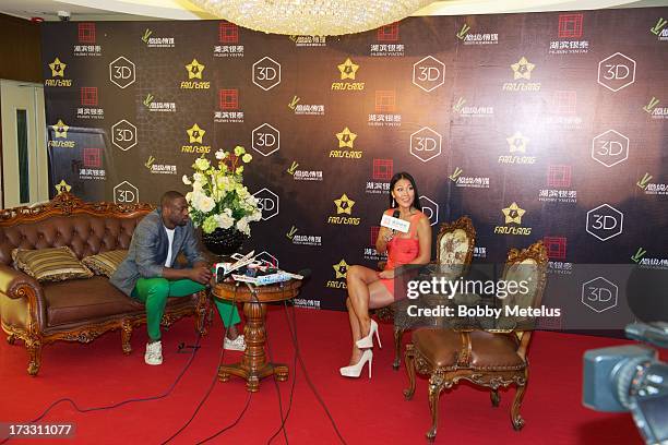 Dwyane Wade speaks during a media interview to discuss the launch of his 3-D Headphones at InTime Mall on July 11, 2013 in Hangzhou, China.