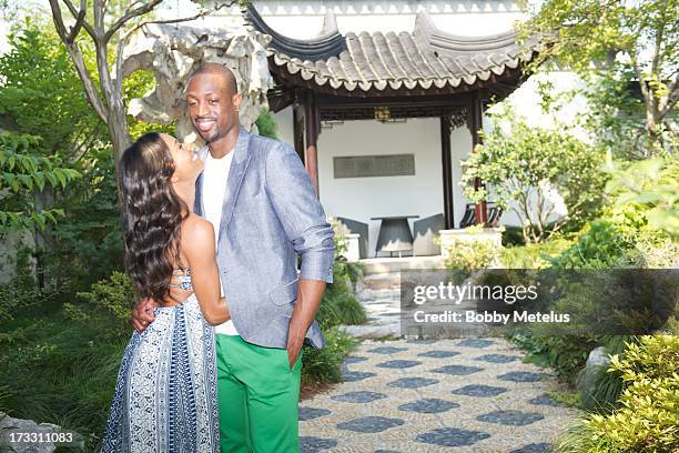 Gabrielle Union and Dwyane Wade take some photos and share a kiss on at Green City Villa on July 11, 2013 in Hangzhou, China.