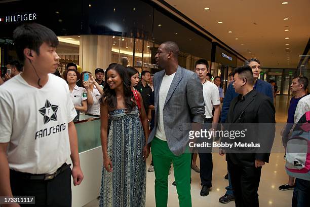 Gabrielle Union and Dwyane Wade visit Time Mall for Wade's 3-D Headphones Launch Event on July 11, 2013 in Hangzhou, China .