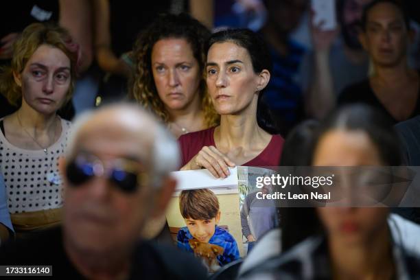 Family and friends of those taken hostage by Hamas during an attack on Israel react as they listen to speeches during a press conference on October...