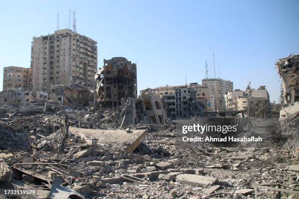 Palestinian citizens inspect damage to their homes caused by Israeli airstrikes on October 13, 2023 in Gaza City, Gaza. Israel has sealed off Gaza...