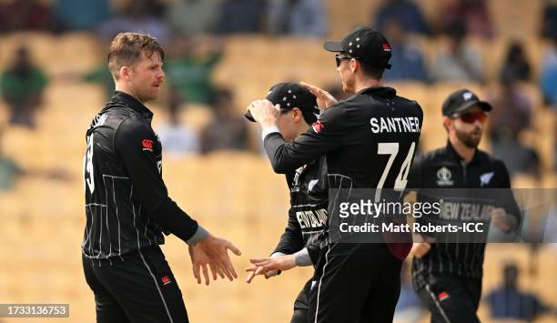 Lockie Ferguson of New Zealand celebrates the wicket of Tanzid Hasan of Bangladesh during the ICC Men's Cricket World Cup India 2023 between New...
